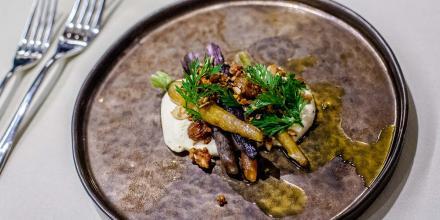 elegantly plated meial on a flat slate plate