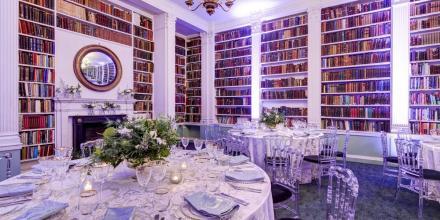Library showing mirror above fireplace